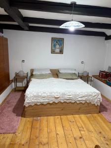 a bedroom with a large bed in a room at Apartmán Amálka in Ktiš