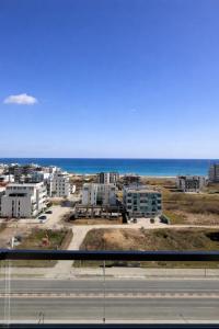 a view of a city with the ocean in the background at Apartament Meraki SeaView in Mamaia Sat/Năvodari