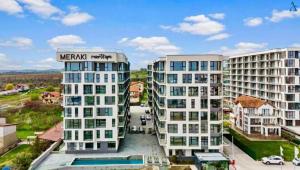 a view of two tall buildings in a city at Apartament Meraki SeaView in Mamaia Sat/Năvodari