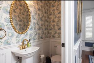 a bathroom with a sink and a toilet at 5BR Historic Downtown Edenton in Edenton +24 photos