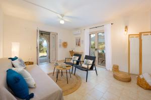 a living room with a couch and a table at Fereniki's place in Gaios