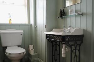 a bathroom with a toilet and a sink at Clock View - Haworth in Haworth +36 photos