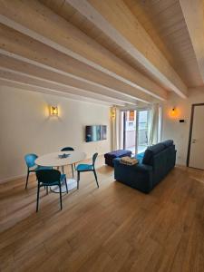 a living room with a table and a couch at Case di Daniela in Chiavari