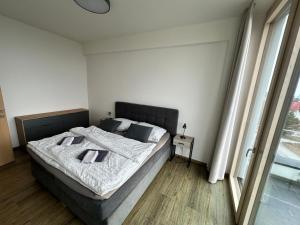 a bedroom with a large bed in a room at Apartmán Tatrya in Vysoké Tatry