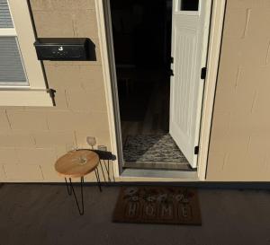 a small table with two wine glasses on it next to a door at Carolina Suite in Chester