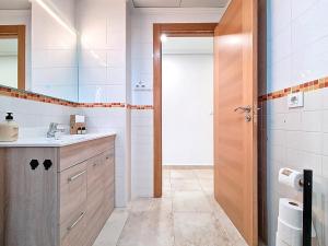 a bathroom with a sink and a toilet and a mirror at San Pedro Centro - 9110 in San Pedro del Pinatar +37 photos