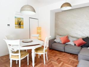 a living room with a table and a couch at Mondello Luxury villa in Palermo