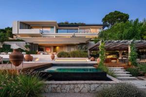 a house with a swimming pool in front of it at Rose Bank in Johannesburg