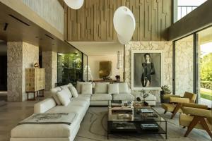 a living room with a white couch and a table at Rose Bank in Johannesburg