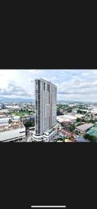 a view of a city with a tall building at Jbs place at Jtower Residences in Mandaue City