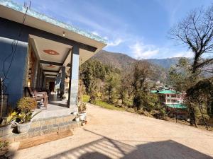 a porch of a house with a view of a mountain at Brekora X RajStays in McLeod Ganj