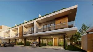 a building with two cars parked in front of it at Villa Luminosa in Punta Cana