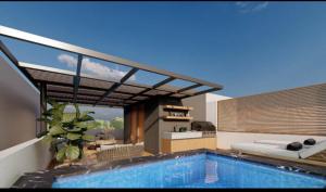 a house with a swimming pool and a bed at Villa Luminosa in Punta Cana