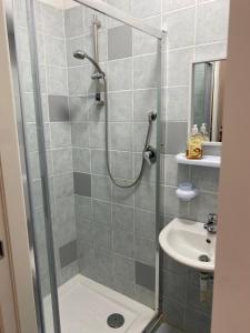 a bathroom with a shower and a sink at Little house in Vasto