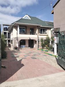 a large house with a balcony and a driveway at The Elite havens in Nairobi