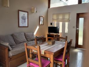 a living room with a table and a couch at Pax Costa del Este - Pax Suites in Costa del Este