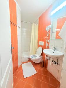a bathroom with a toilet and a sink at Luxury Apartments Miranda in Ohrid