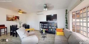 a living room with a couch and two chairs at Best area and ocean view in Cruz de Huanacaxtle