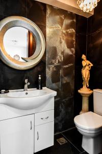 a bathroom with a sink and a mirror at Sea View Beachfront Villa Maria in Gouves +50 photos
