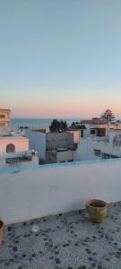 a view of a city from the roof of a building at Dar Sonia in Hammamet