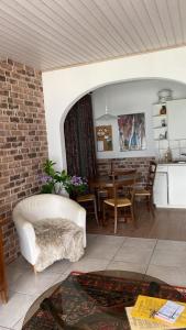 a living room with a white couch and a table at Girasole Orselina in Orselina