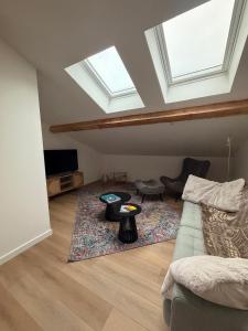 a living room with a couch and a table at La Bulle d Ax in Ax-les-Thermes