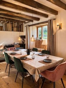 a dining room with a large table and chairs at Woolladon Hall in Meeth