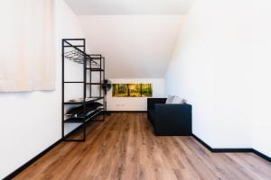 a living room with a ladder and a couch at Seethal in Laufen