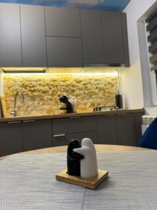 a swan figurine sitting on a table in a kitchen at Woodxury in Petrila