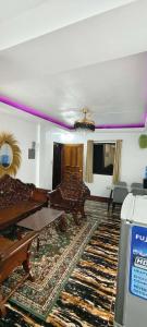 a living room with a couch and a table at Amor apartment in Coron