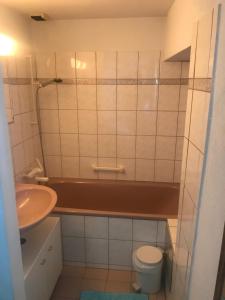 a small bathroom with a sink and a toilet at Girasole Orselina in Orselina +48 photos