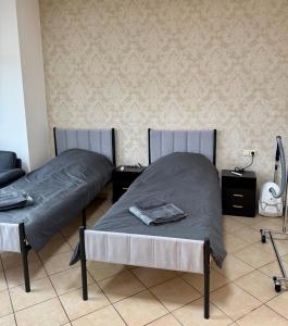 two beds sitting next to each other in a room at Apartment-Herrlingen in Blaustein