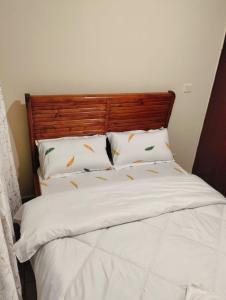 Un pat sau paturi într-o cameră la JJhomes