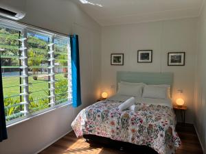 a bedroom with a bed and a large window at Kooyong Apartments, Arcadia in Arcadia +82 photos