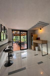 a living room with a table and chairs in it at Pixel House Hotel in Medellín