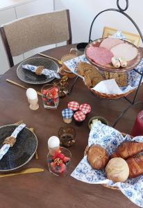 a table with plates and other food on it at TuksandDutsMeppel in Meppel