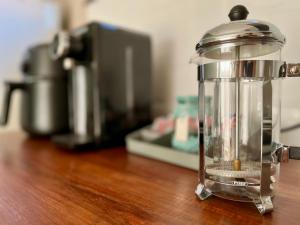 a food processor sitting on a wooden table at Makiti Retreat in Polokwane