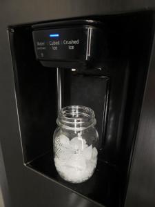 a glass jar of food is in an oven at MaxiMar Apartment With Sauna in Valga
