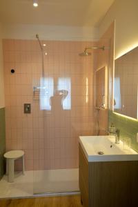 a bathroom with a sink and a shower with a mirror at Villa alle Mura in Lucca +26 photos