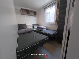 a room with two bunk beds and a window at La Carabasse / Mazet 69 in Vias +15 photos