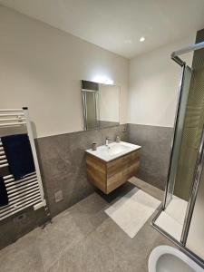 a bathroom with a sink and a shower at Case di Daniela in Chiavari +32 photos