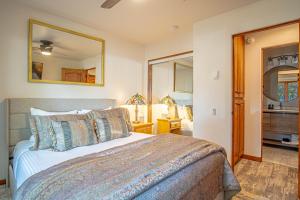 a bedroom with a bed and a mirror at Sun Valley Condo 123 in Ketchum +36 photos