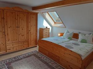 a bedroom with a bed and a skylight at Forsthaus Stagnieß in Ueckeritz