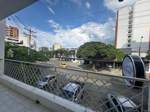 a view of a city street from a balcony at HOTEL ASL HOME CALI NORTE - Hospedaje AV 6A NORTE in Cali +8 photos