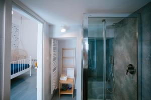 a bathroom with a shower with a glass door at Residenza Delle Sirene in Gaeta