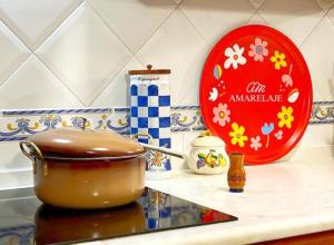 a pot sitting on top of a counter next to a plate at Amarelaje in Serra de El-Rei +30 photos