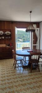 a dining room with a table and two chairs at Nice postion, belle vue in Pučišća