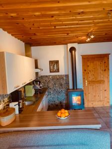 a kitchen with a counter with a stove at Ferienwohnung Oberprossegg in Matrei in Osttirol