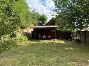 a cabin with a table and chairs in front of it at Holiday home in Qusar