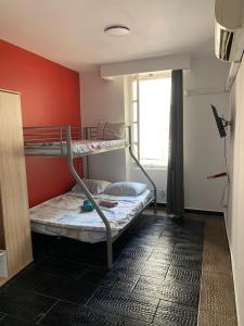 a room with two bunk beds and a window at capitol in Marseille
